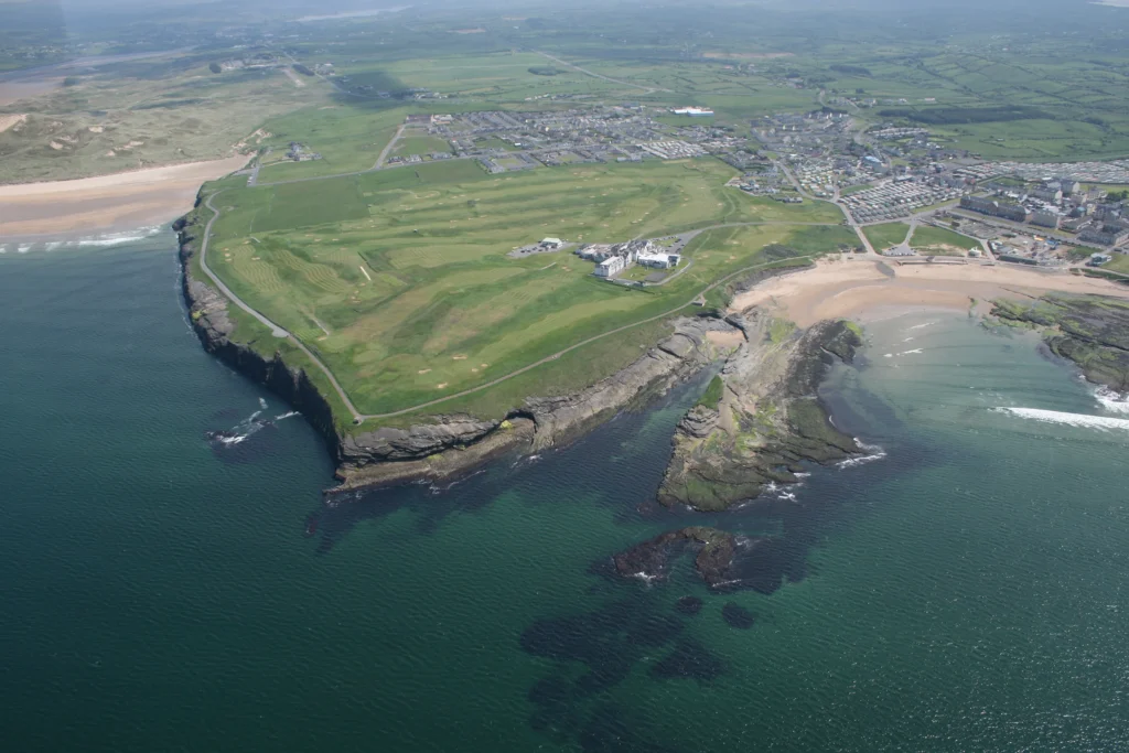 Aerial view of Bundoran Golf Club on the Donegal coast with the clubhouse above the cliffs and the beach